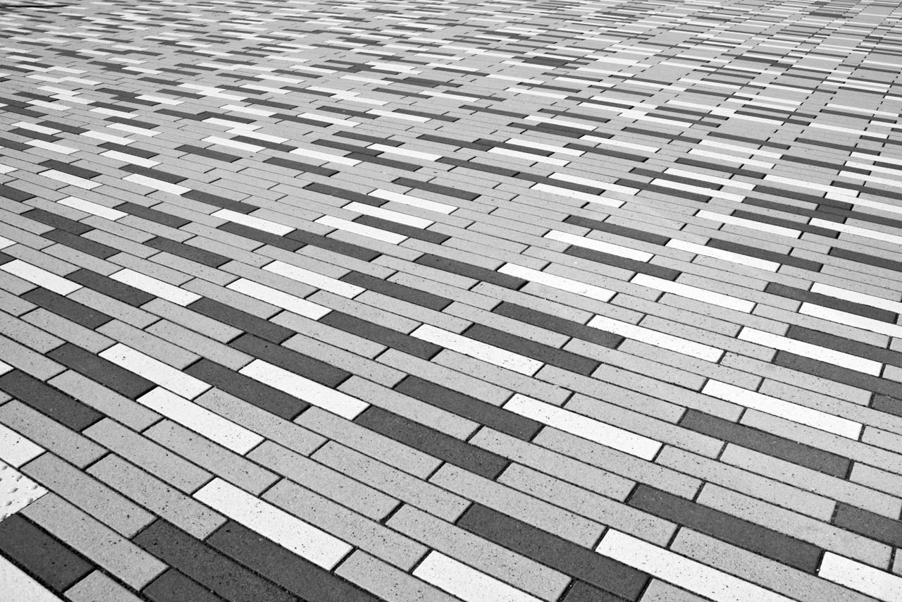 gallery-4 Abstract black and white patterned brick floor provides a geometric visual effect.